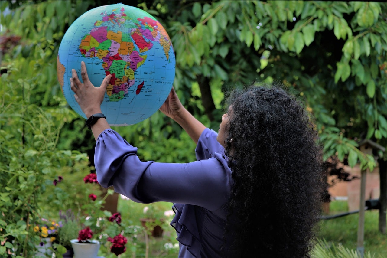 Starting a Podcast Woman Holding Inflatable Globe